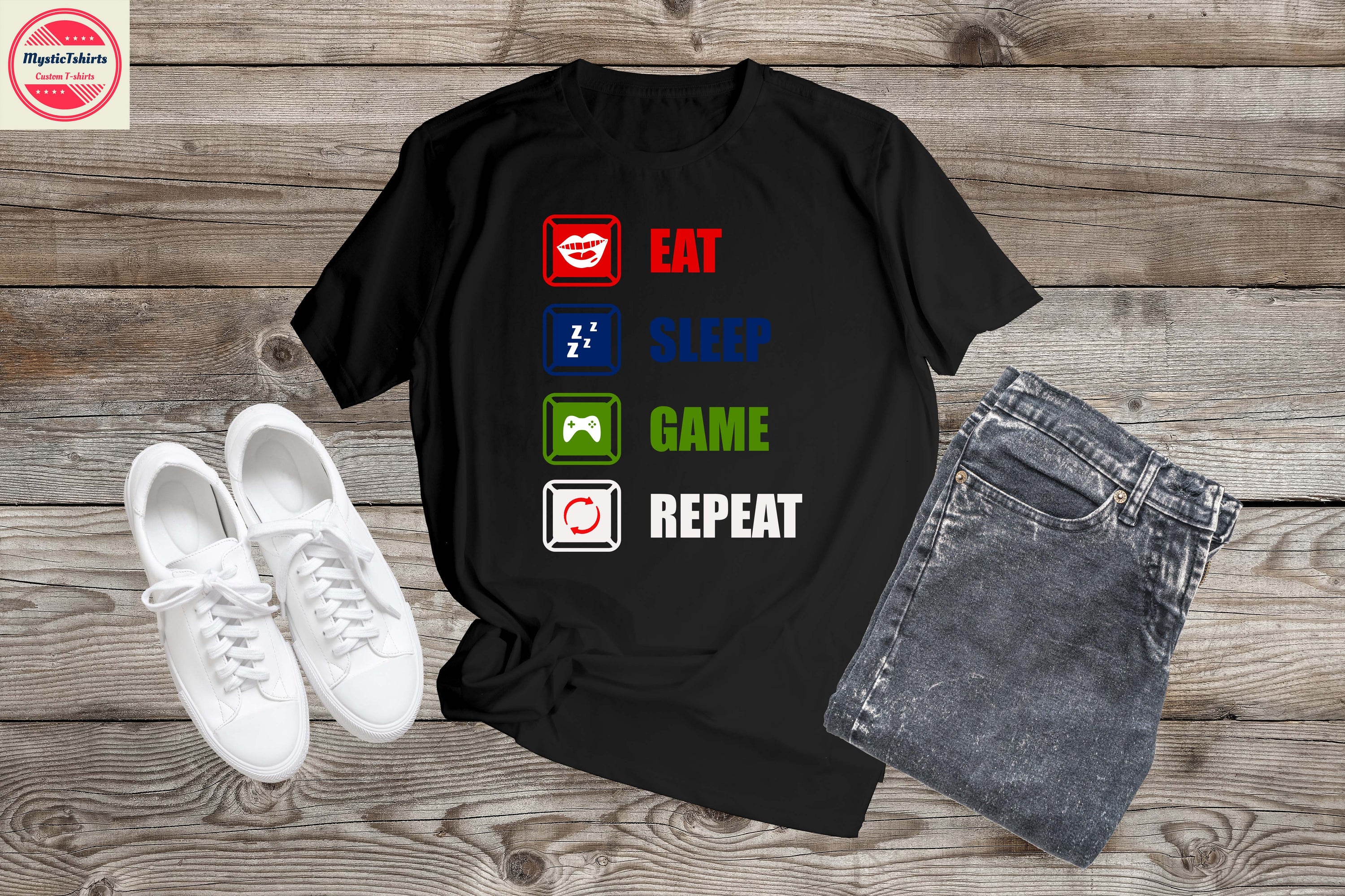 Custom 'Eat Sleep Game Repeat' T-shirt displayed on a hanger, showcasing vibrant colors and high-quality fabric.