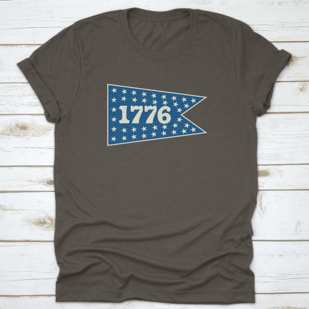 1776 Centennial Banner Pennant shirt featuring a classic fit, made from 100% cotton, ideal for travel and celebrating American history.