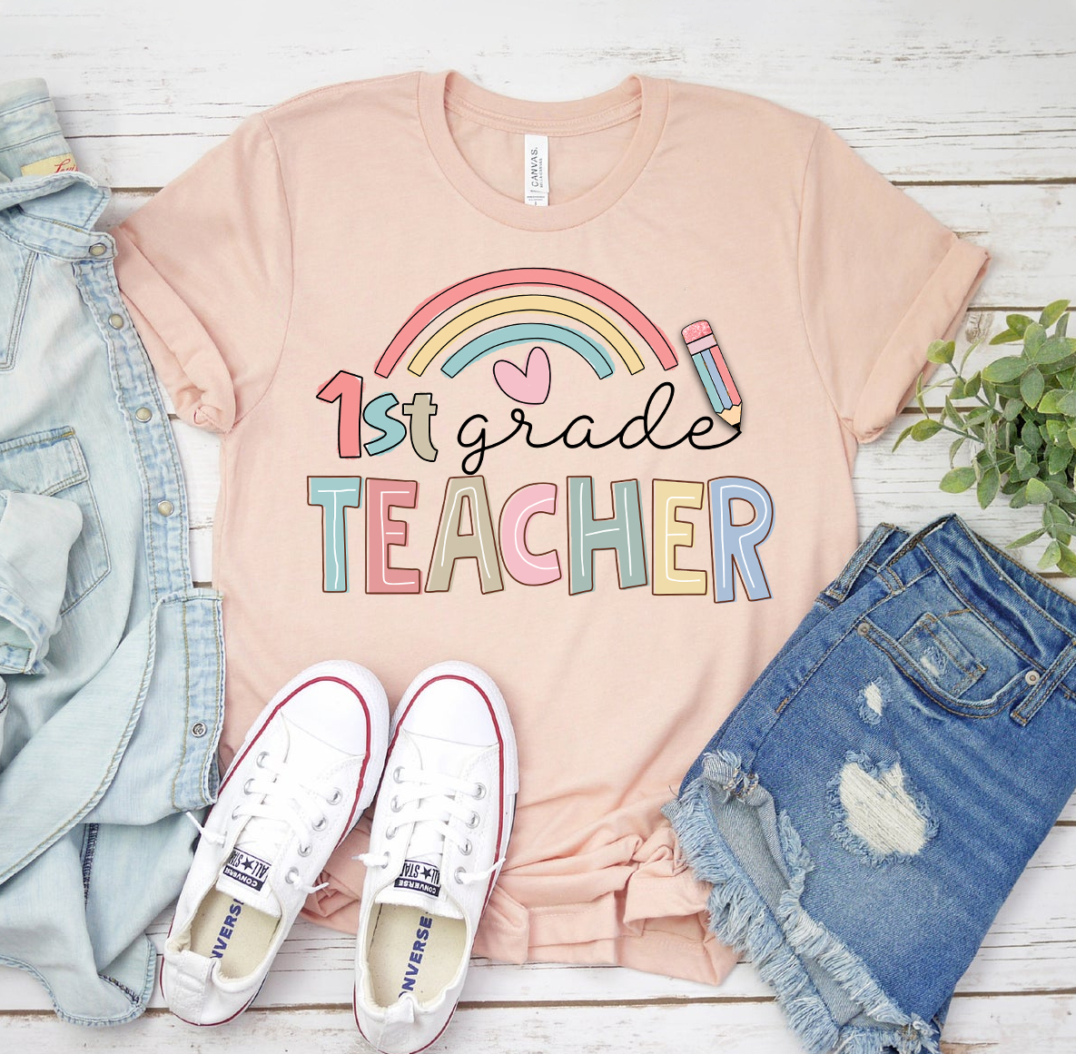 A stylish 1st Grade Teacher T-shirt made of premium ring spun cotton, featuring a vibrant flex print design.