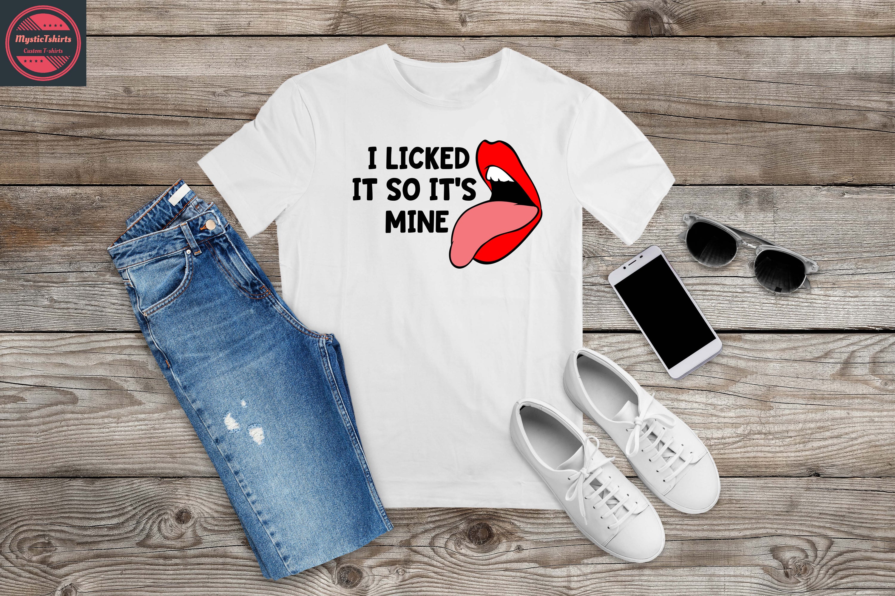 Personalized T-shirt with the phrase 'I LICKED IT SO IT'S MINE', showcasing custom text options and vibrant colors.