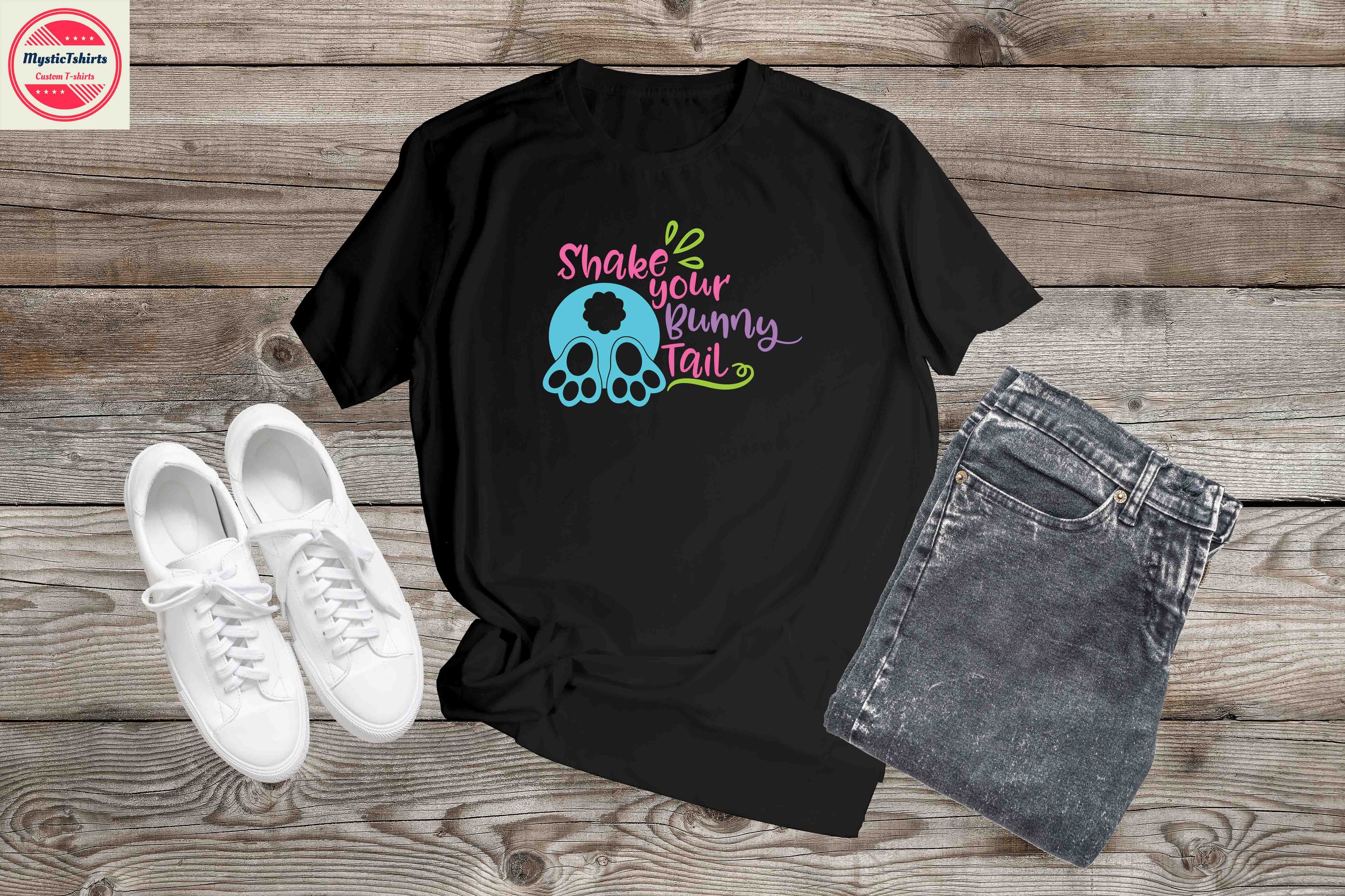 Custom made 'Shake Your Bunny Tale' T-shirt featuring vibrant colors and unique design, perfect for any occasion.