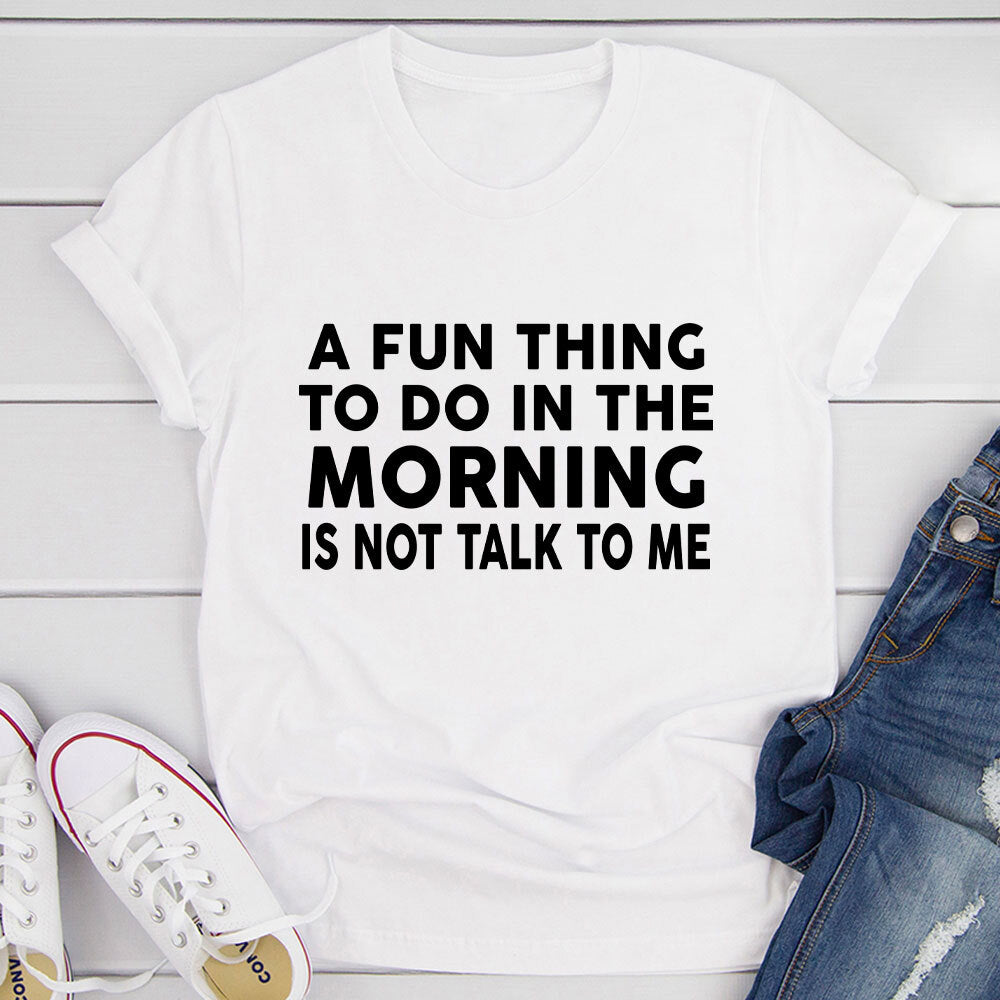 A Fun Thing To Do In The Morning T-Shirt displayed on a mannequin, showcasing its soft cotton fabric and double-stitched neckline.