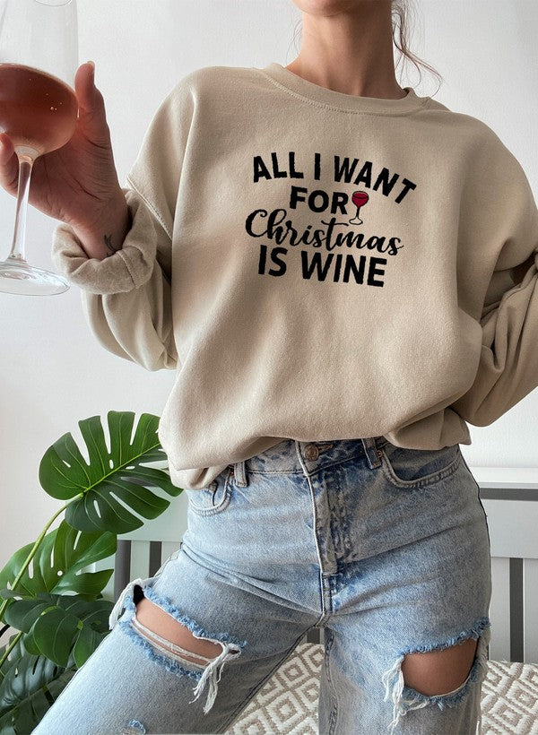 Cozy 'All I Want For Christmas Is Wine' sweatshirt featuring festive design and adjustable cuffs, perfect for winter wear.