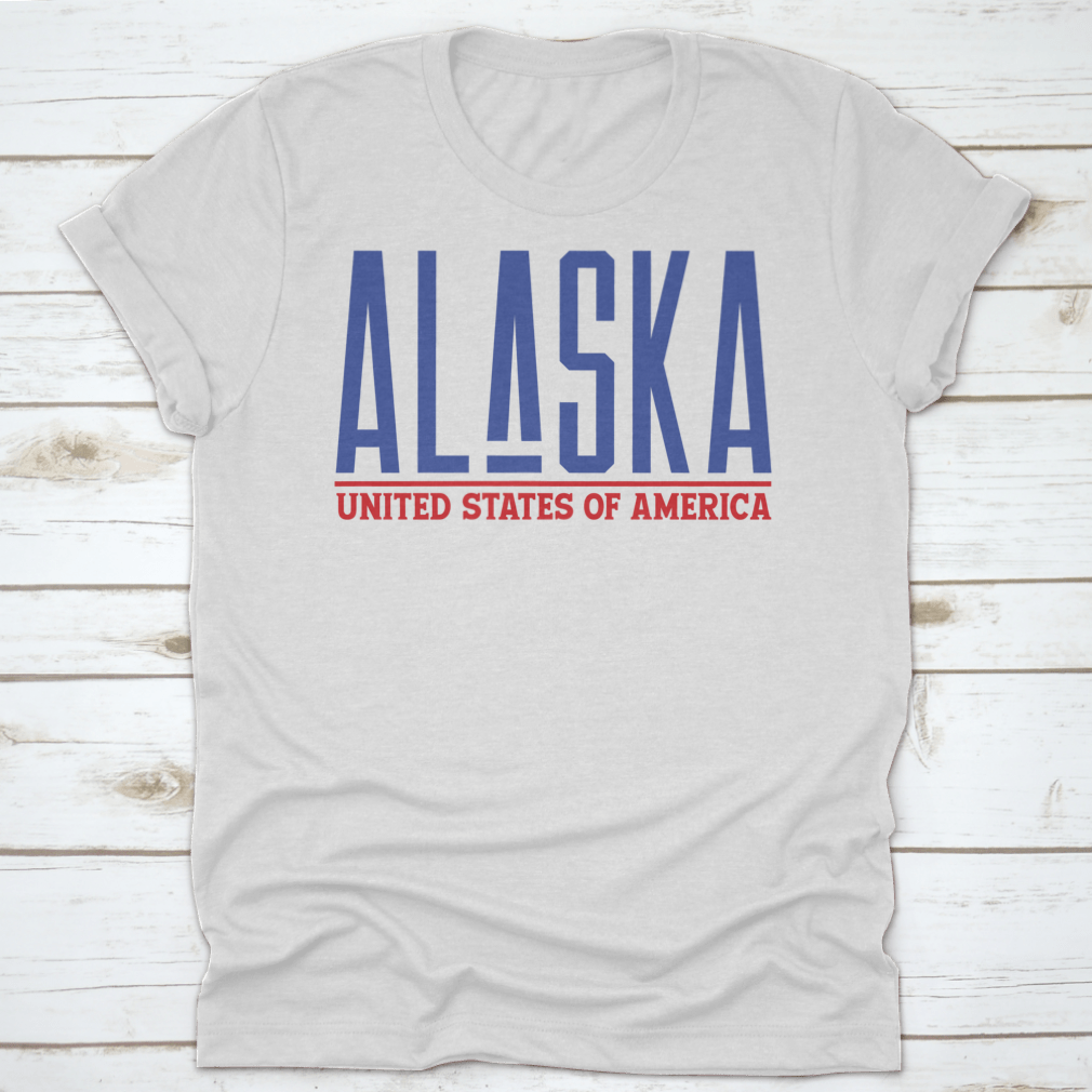 Alaska Modern Name Vector Graphic Shirt displayed on a hanger, showcasing its unique design and quality fabric.