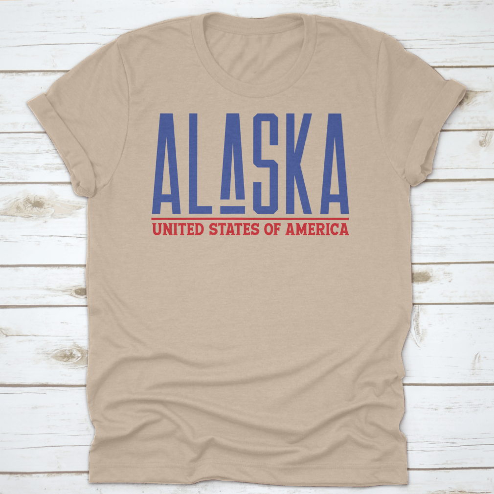 Alaska Modern Name Vector Graphic Shirt displayed on a hanger, showcasing its unique design and quality fabric.