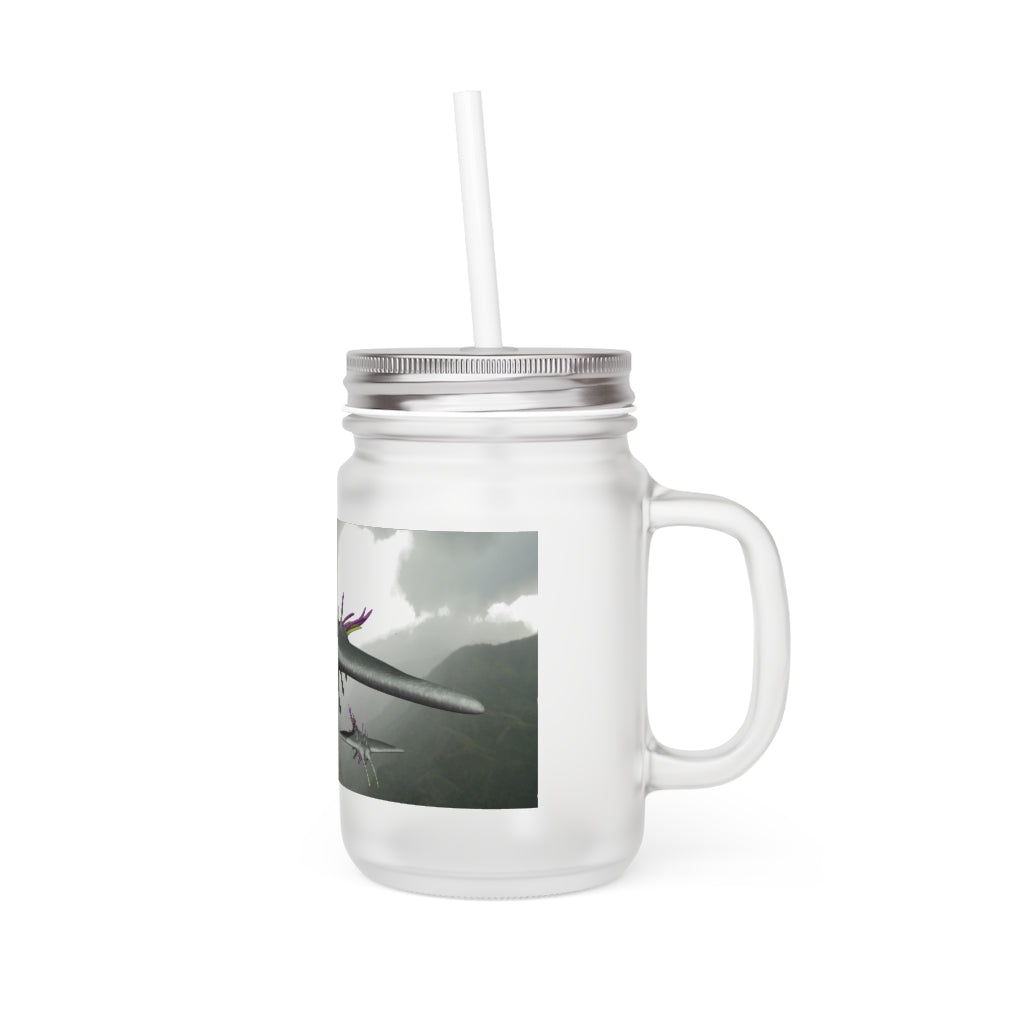 A stylish Alpha Creature Mason Jar made of frosted glass, featuring a straw and lid, perfect for personalized drinks.