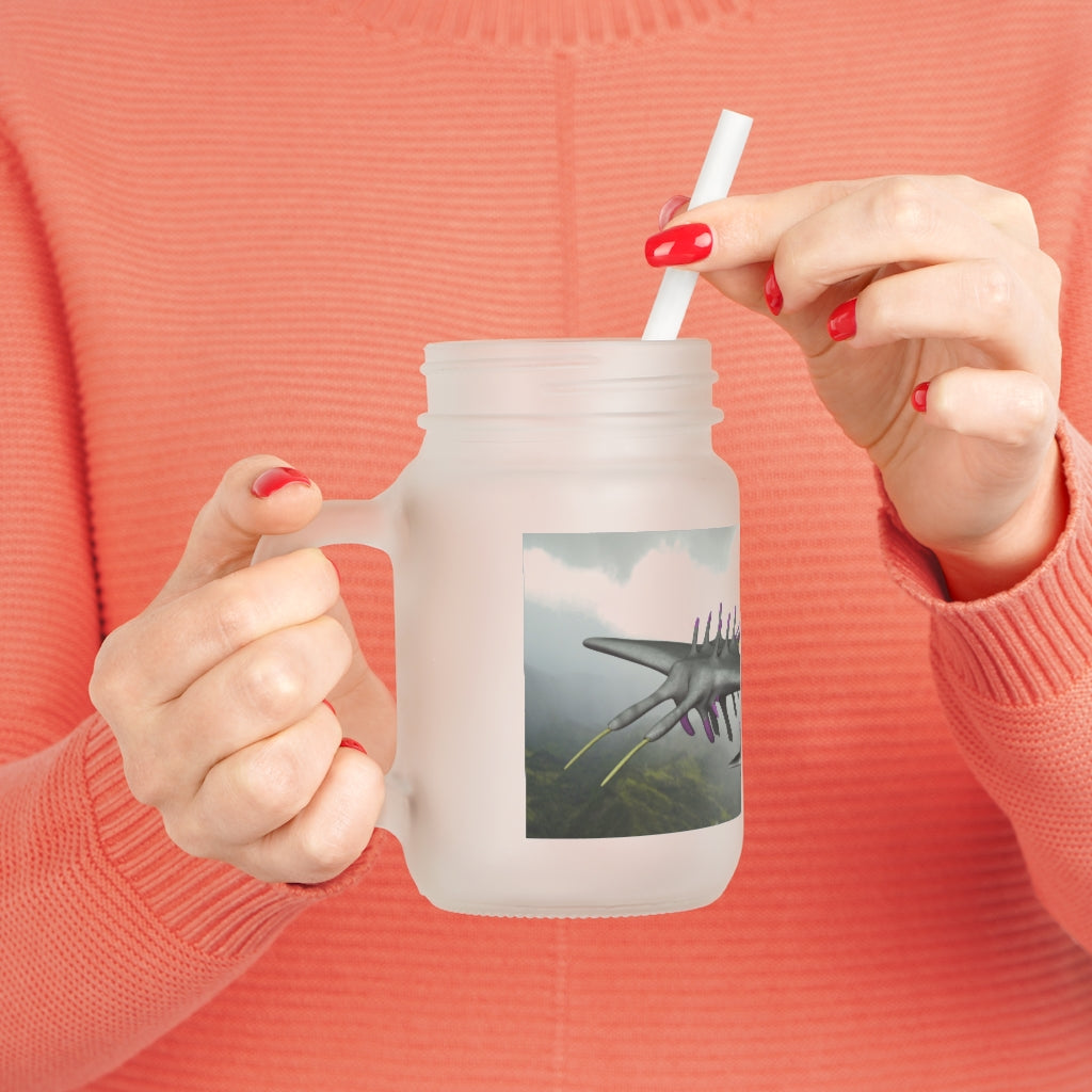 A stylish Alpha Creature Mason Jar made of frosted glass, featuring a straw and lid, perfect for personalized drinks.