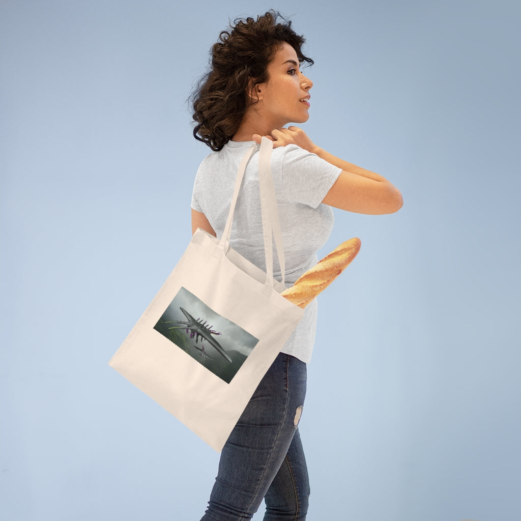 Alpha Creature Tote Bag made of 100% cotton with long handles and cross-stitched detailing, available in multiple colors.