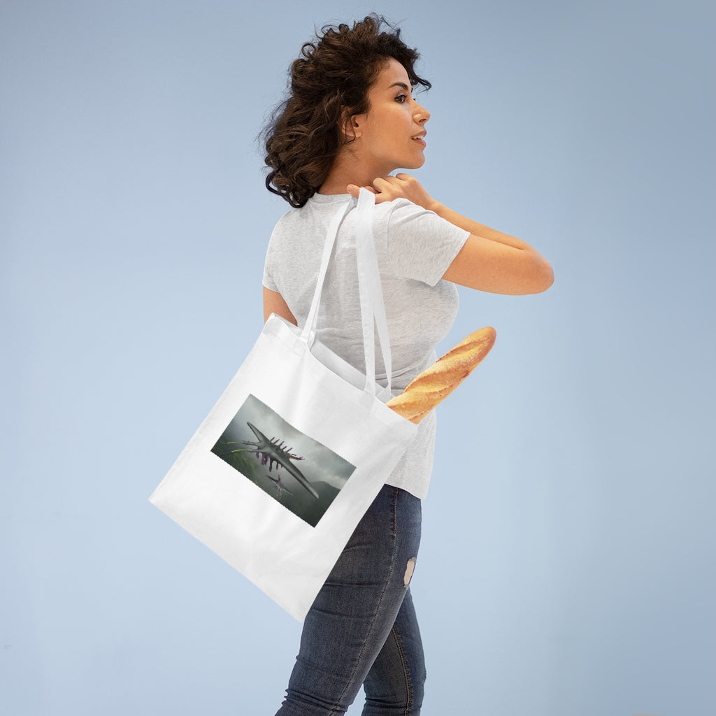 Alpha Creature Tote Bag made of 100% cotton with long handles and cross-stitched detailing, available in multiple colors.