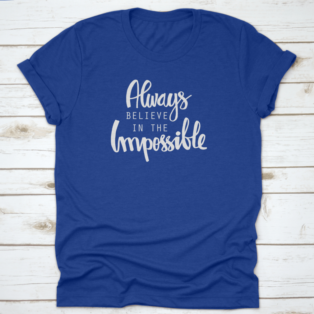 A motivational T-shirt featuring the quote 'Always Believe In The Impossible' in a stylish design, made from soft cotton fabric.