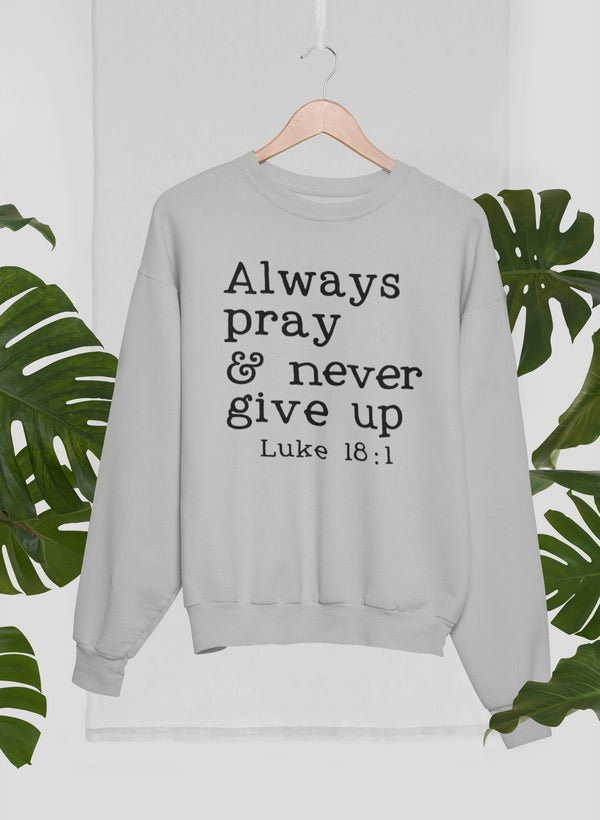 A cozy Always Pray & Never Give Up Sweat Shirt made from 100% premium soft cotton, featuring a motivational print.