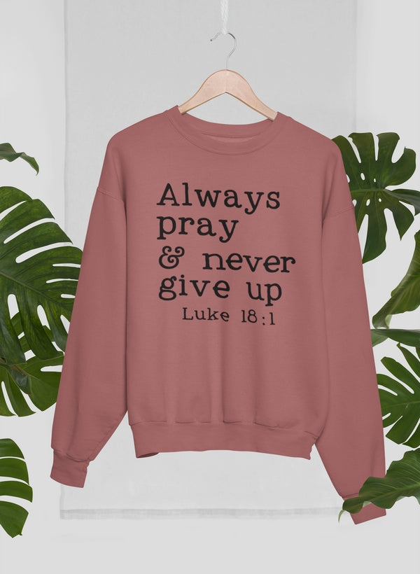 A cozy Always Pray & Never Give Up Sweat Shirt made from 100% premium soft cotton, featuring a motivational print.