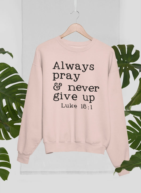 A cozy Always Pray & Never Give Up Sweat Shirt made from 100% premium soft cotton, featuring a motivational print.