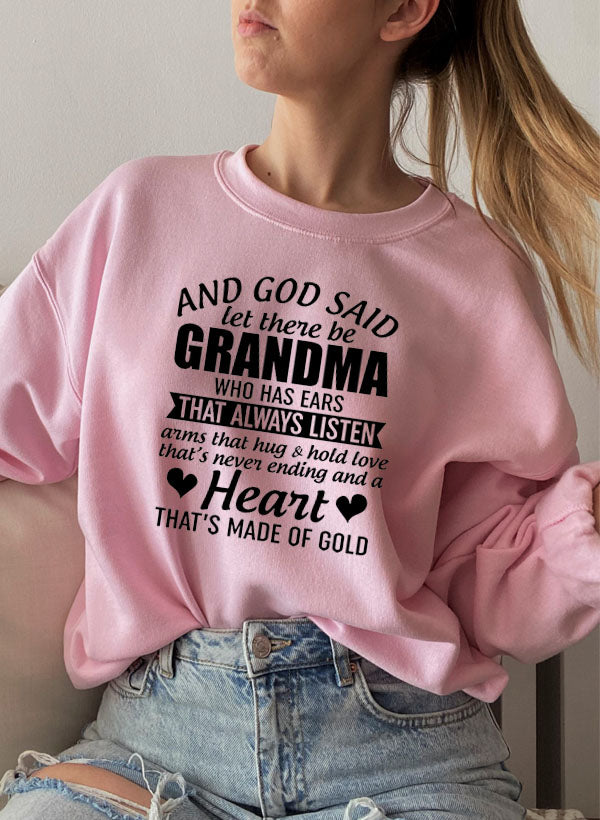 Cozy sweatshirt featuring the phrase 'And God Said Let There Be Grandma', made from a soft cotton/poly fleece blend.