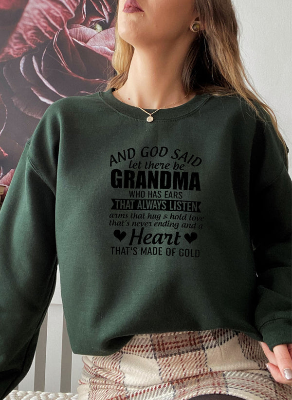 Cozy sweatshirt featuring the phrase 'And God Said Let There Be Grandma', made from a soft cotton/poly fleece blend.