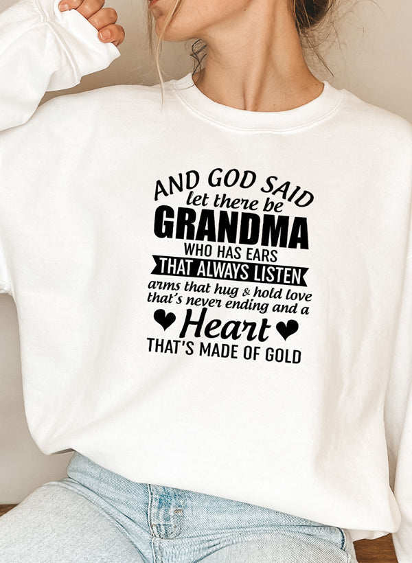 Cozy sweatshirt featuring the phrase 'And God Said Let There Be Grandma', made from a soft cotton/poly fleece blend.