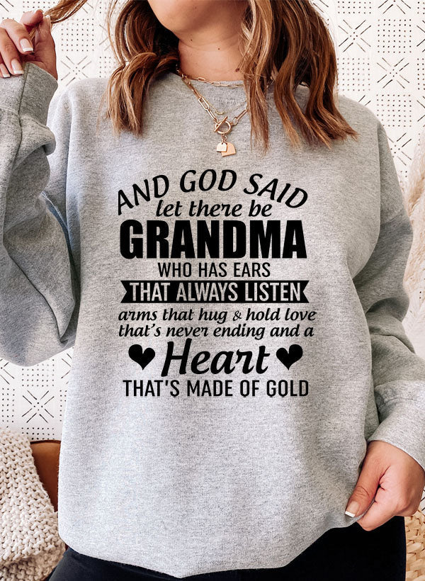 Cozy sweatshirt featuring the phrase 'And God Said Let There Be Grandma', made from a soft cotton/poly fleece blend.