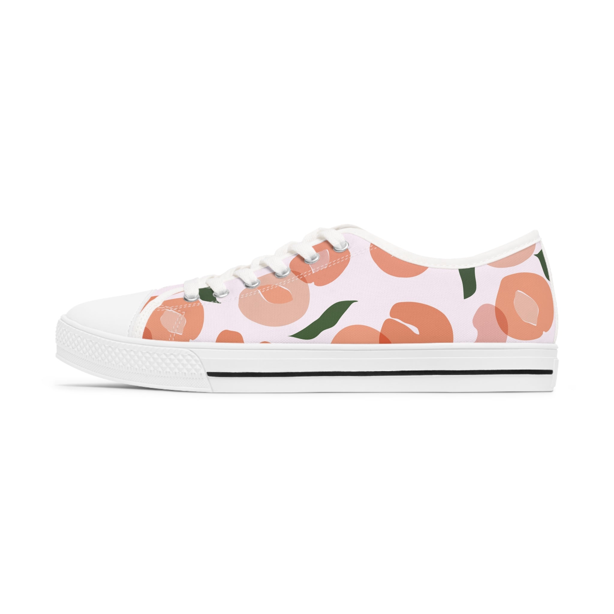 A pair of Apricot Women's Low Top Sneakers in black and white, showcasing breathable polyester canvas and stylish silver metal eyelets.