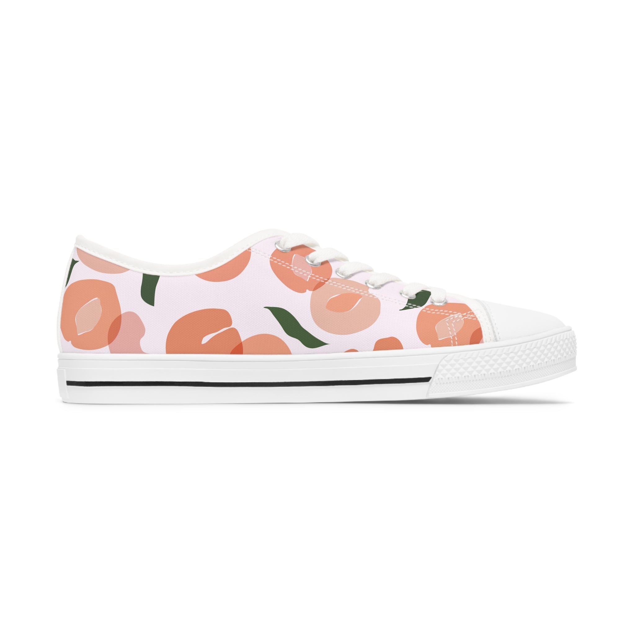 A pair of Apricot Women's Low Top Sneakers in black and white, showcasing breathable polyester canvas and stylish silver metal eyelets.