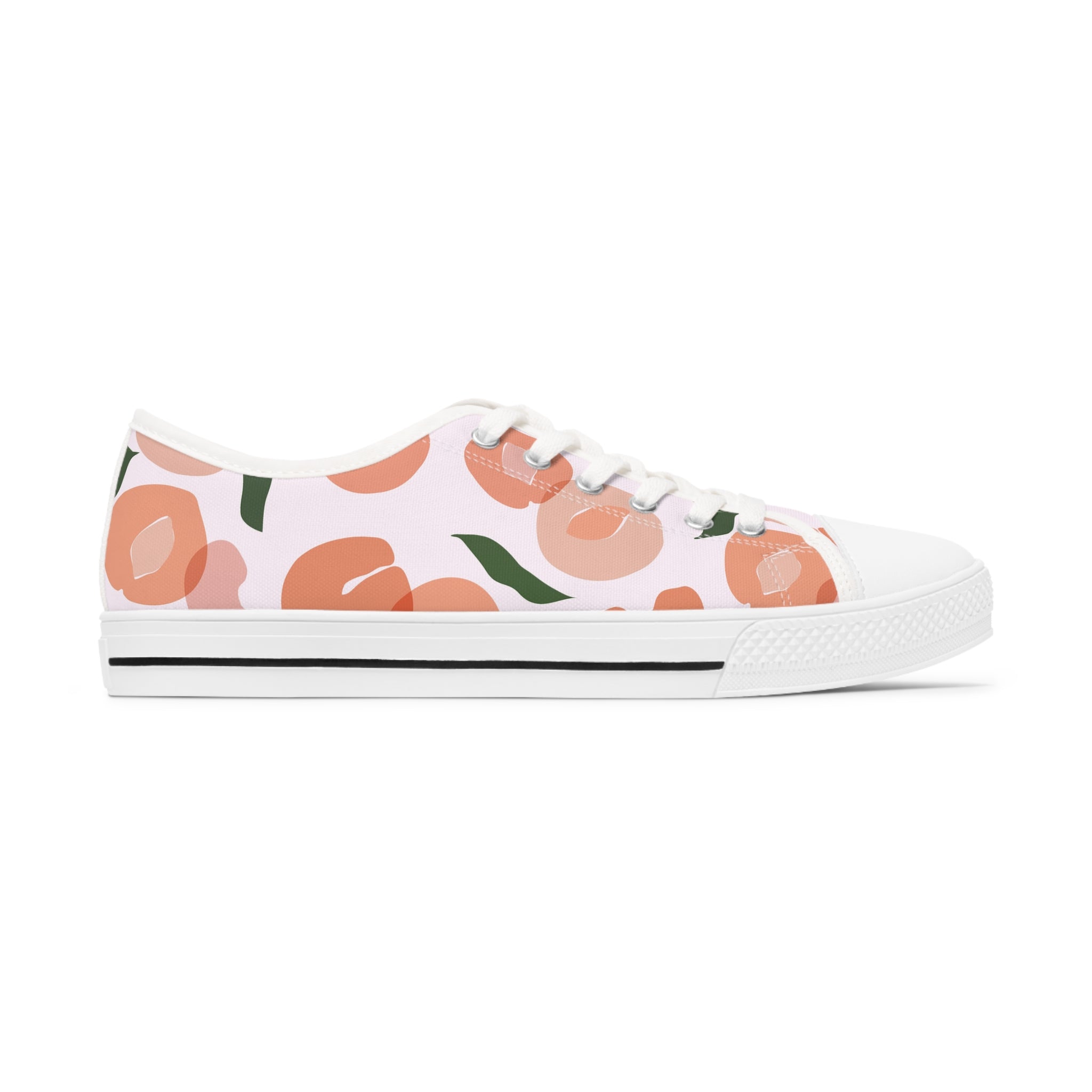 A pair of Apricot Women's Low Top Sneakers in black and white, showcasing breathable polyester canvas and stylish silver metal eyelets.