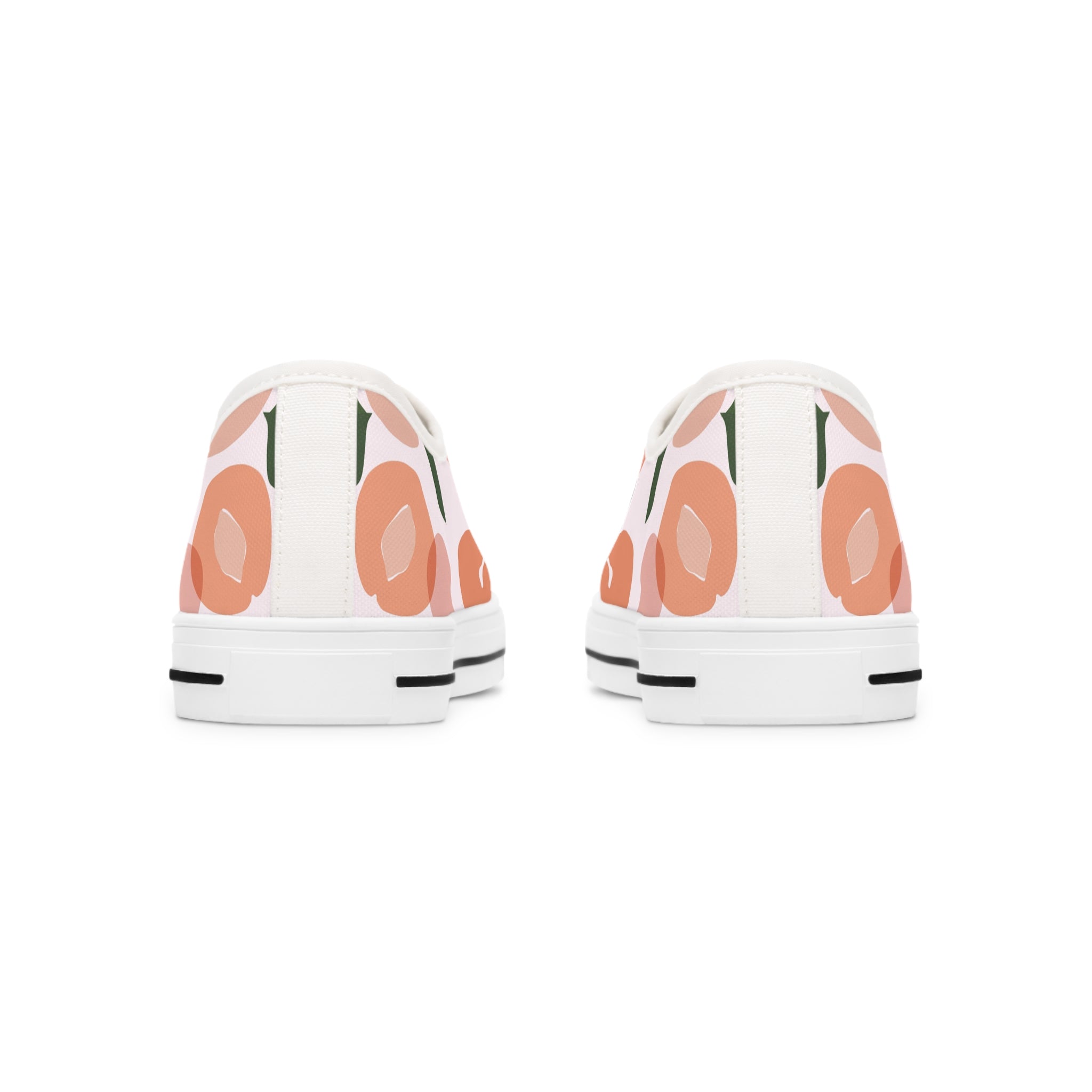 A pair of Apricot Women's Low Top Sneakers in black and white, showcasing breathable polyester canvas and stylish silver metal eyelets.