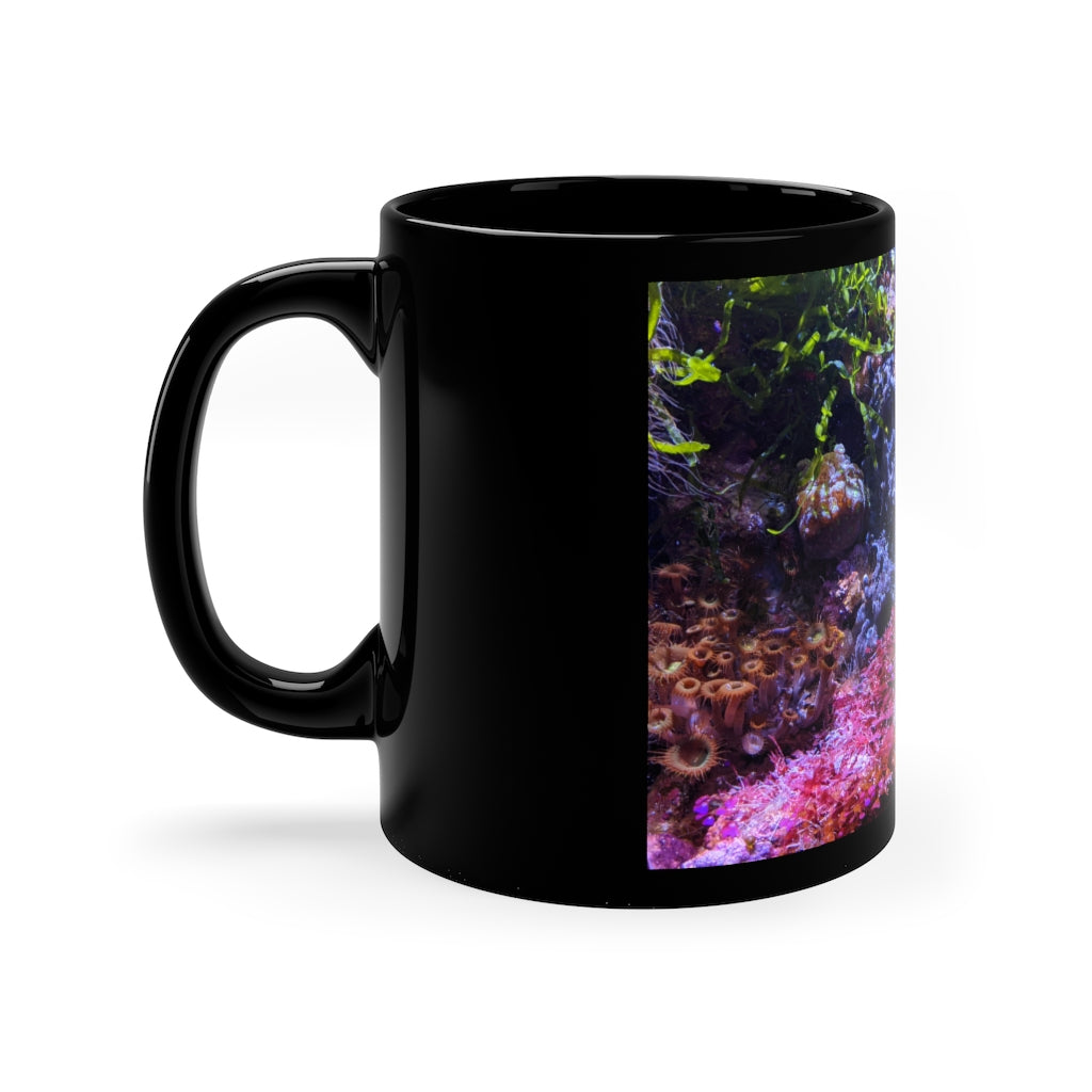 A stylish 11oz black ceramic mug with a C-handle, perfect for coffee, tea, or hot chocolate, featuring customizable designs.