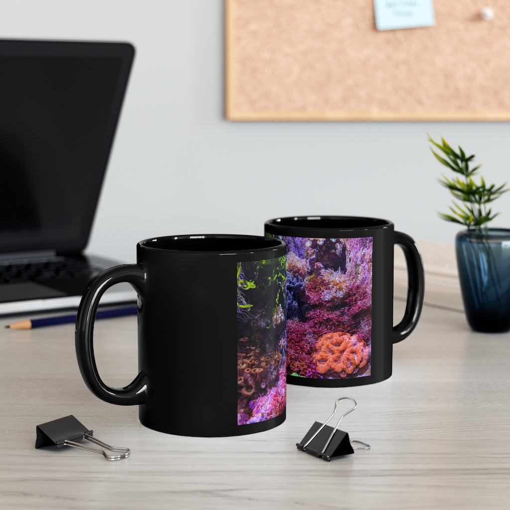 A stylish 11oz black ceramic mug with a C-handle, perfect for coffee, tea, or hot chocolate, featuring customizable designs.