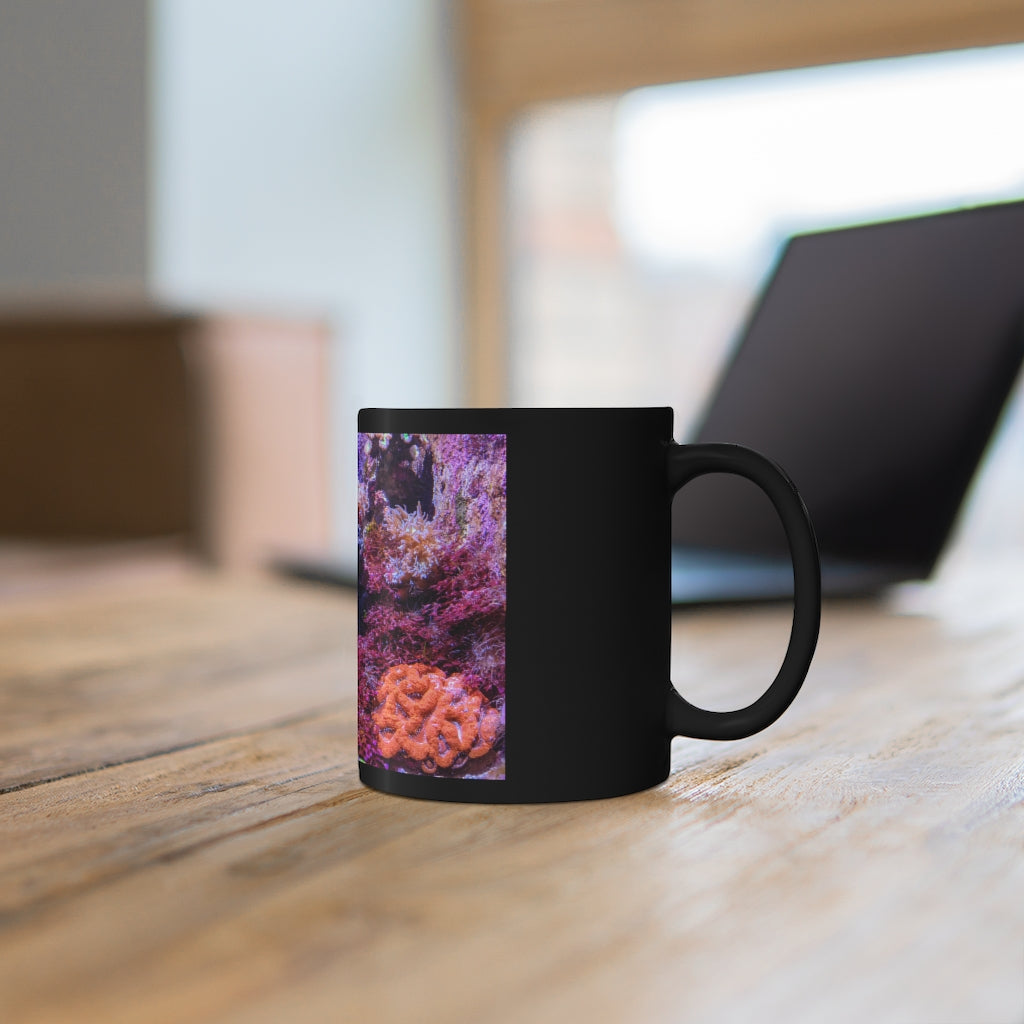 A stylish 11oz black ceramic mug with a C-handle, perfect for coffee, tea, or hot chocolate, featuring customizable designs.