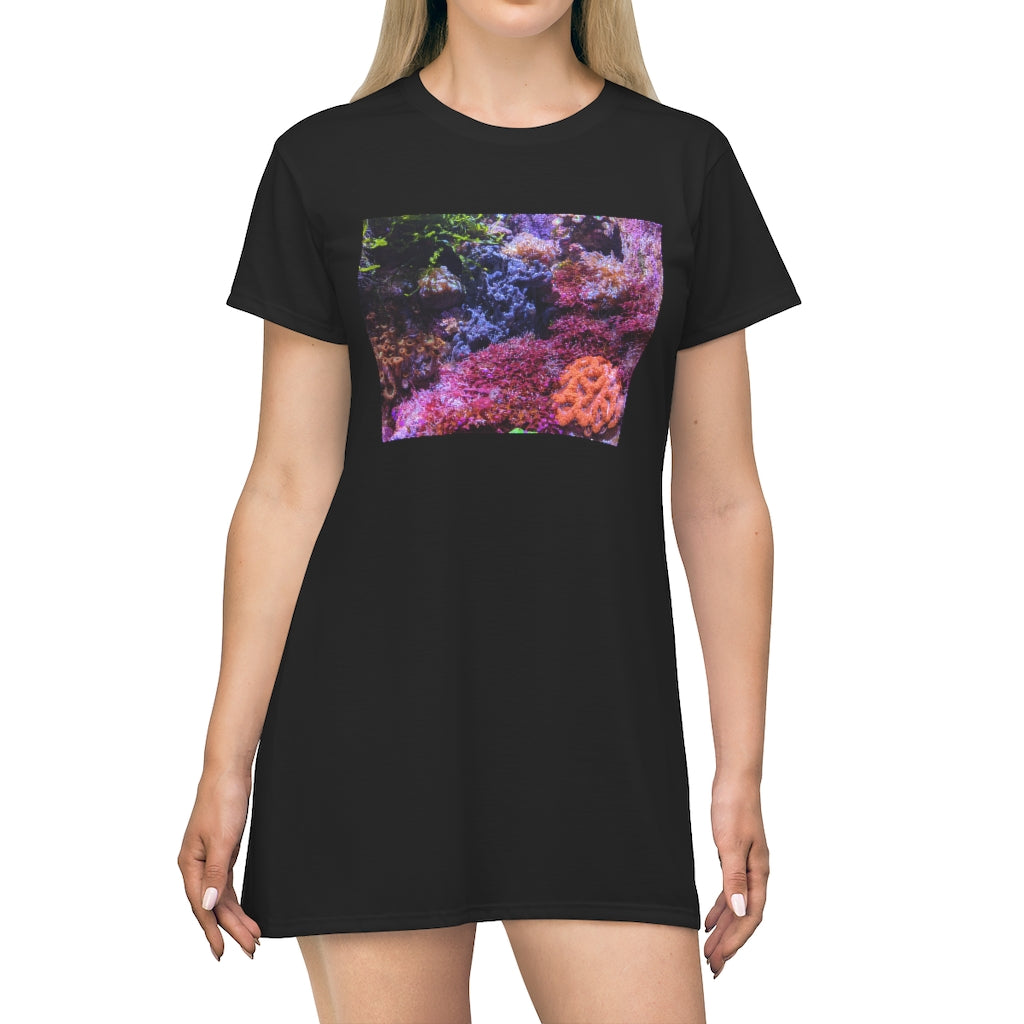 A vibrant aquarium-themed all-over print T-shirt dress, showcasing colorful marine life designs on a lightweight fabric.