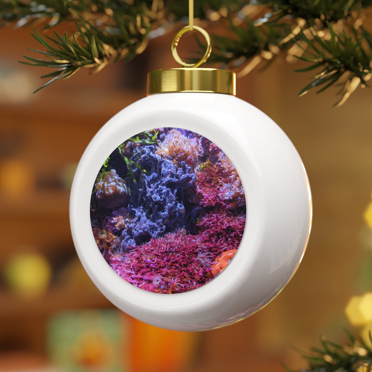 A beautiful 3-inch ceramic Christmas ball ornament with a glossy finish, featuring a gold ribbon for hanging and a vintage style design.