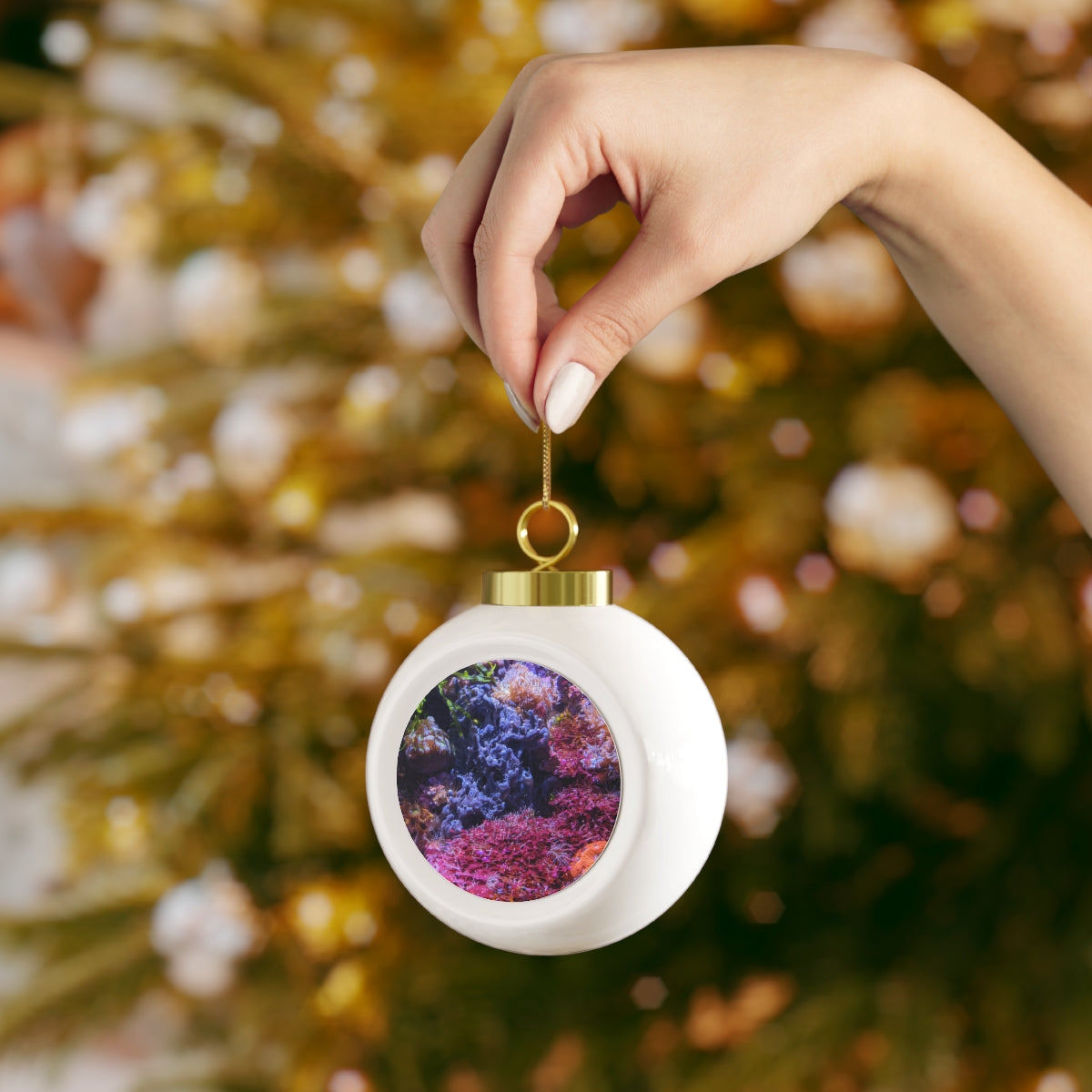 A beautiful 3-inch ceramic Christmas ball ornament with a glossy finish, featuring a gold ribbon for hanging and a vintage style design.