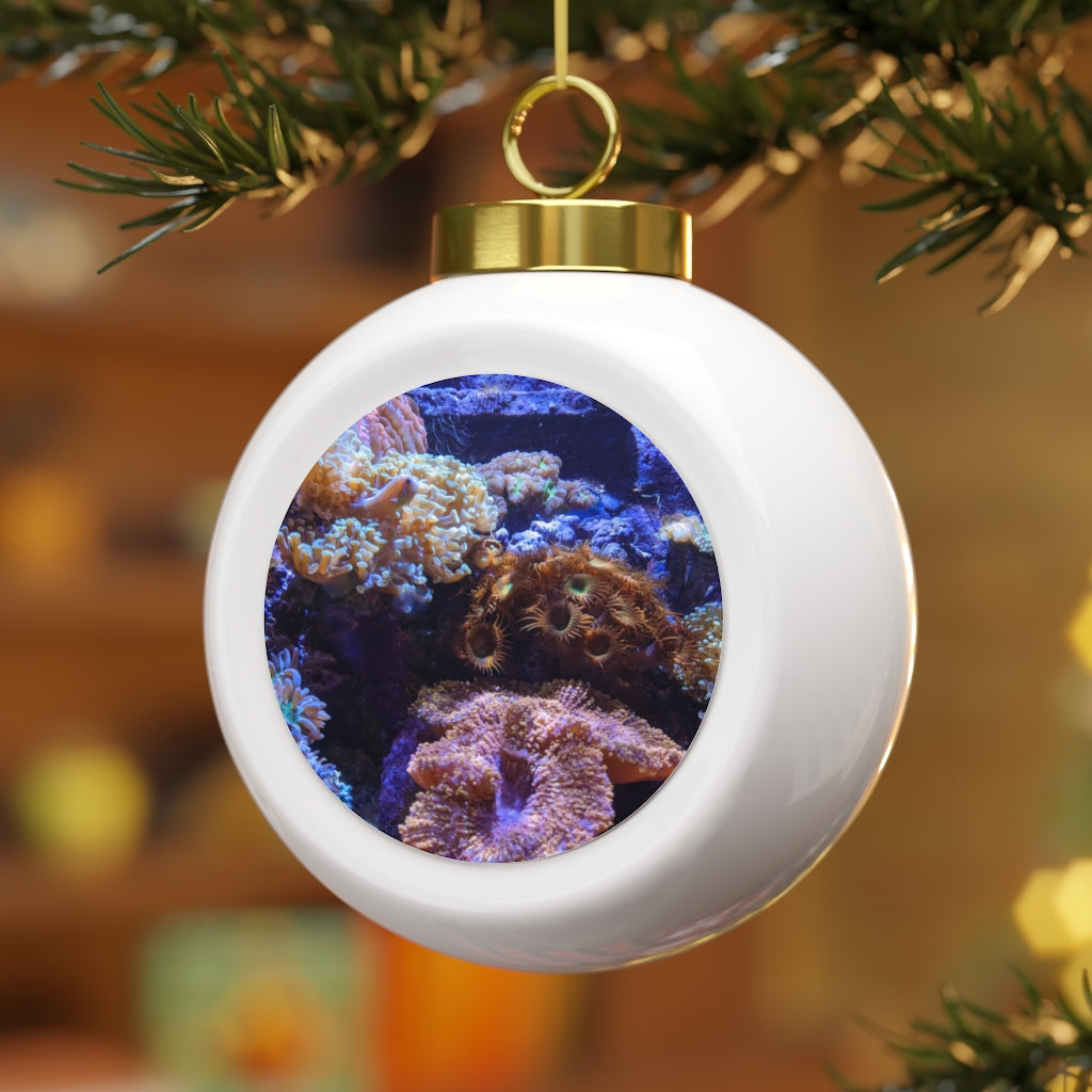 A beautiful 3-inch ceramic Christmas ball ornament with a glossy finish, featuring a gold ribbon for hanging and a vintage design.