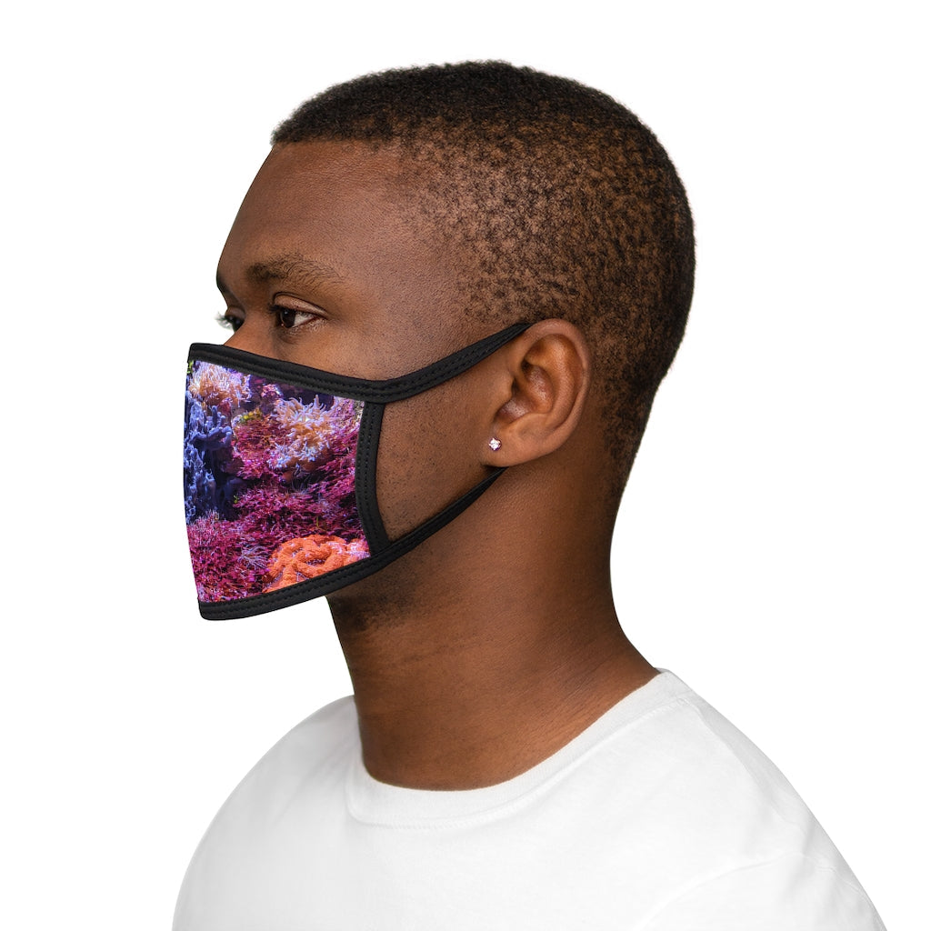 Aquarium Mixed-Fabric Face Mask featuring a vibrant aquarium design with a black outer edge and earloops.