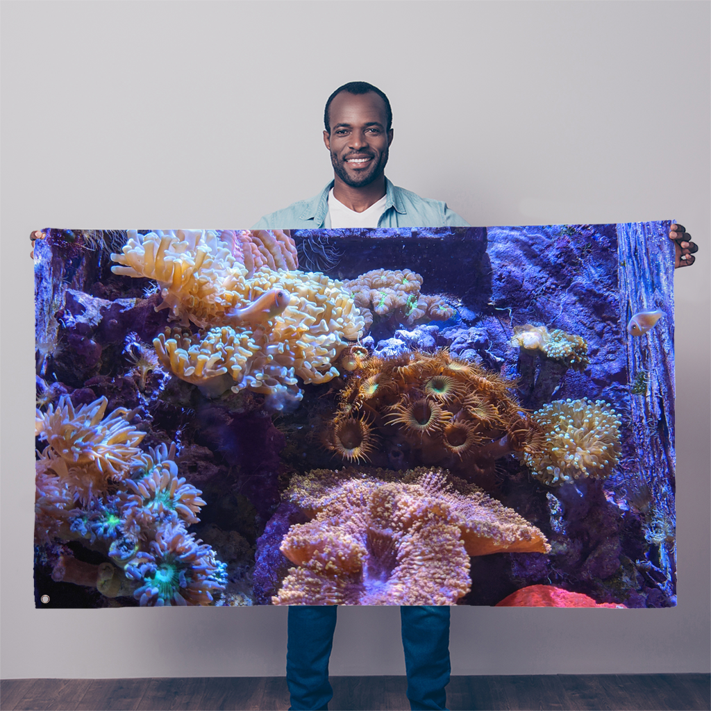 A vibrant Aquarium Sublimation Flag featuring colorful marine life, made from durable polyester fabric with double-stitched edges and eyelets for easy hanging.