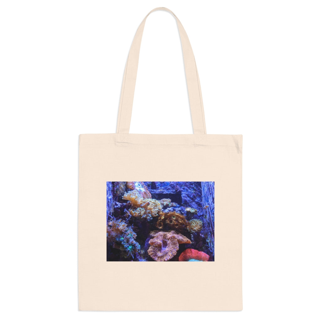 A colorful Aquarium Tote Bag made of 100% cotton with long handles and cross stitching for added stability, perfect for carrying various items.