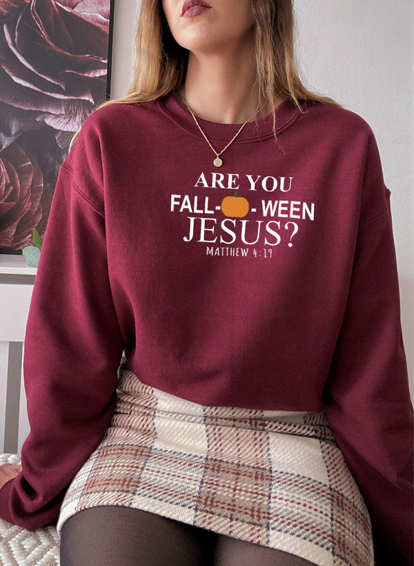 Are You Falloween Jesus Sweat Shirt featuring a cozy fleece design, perfect for fall wear.