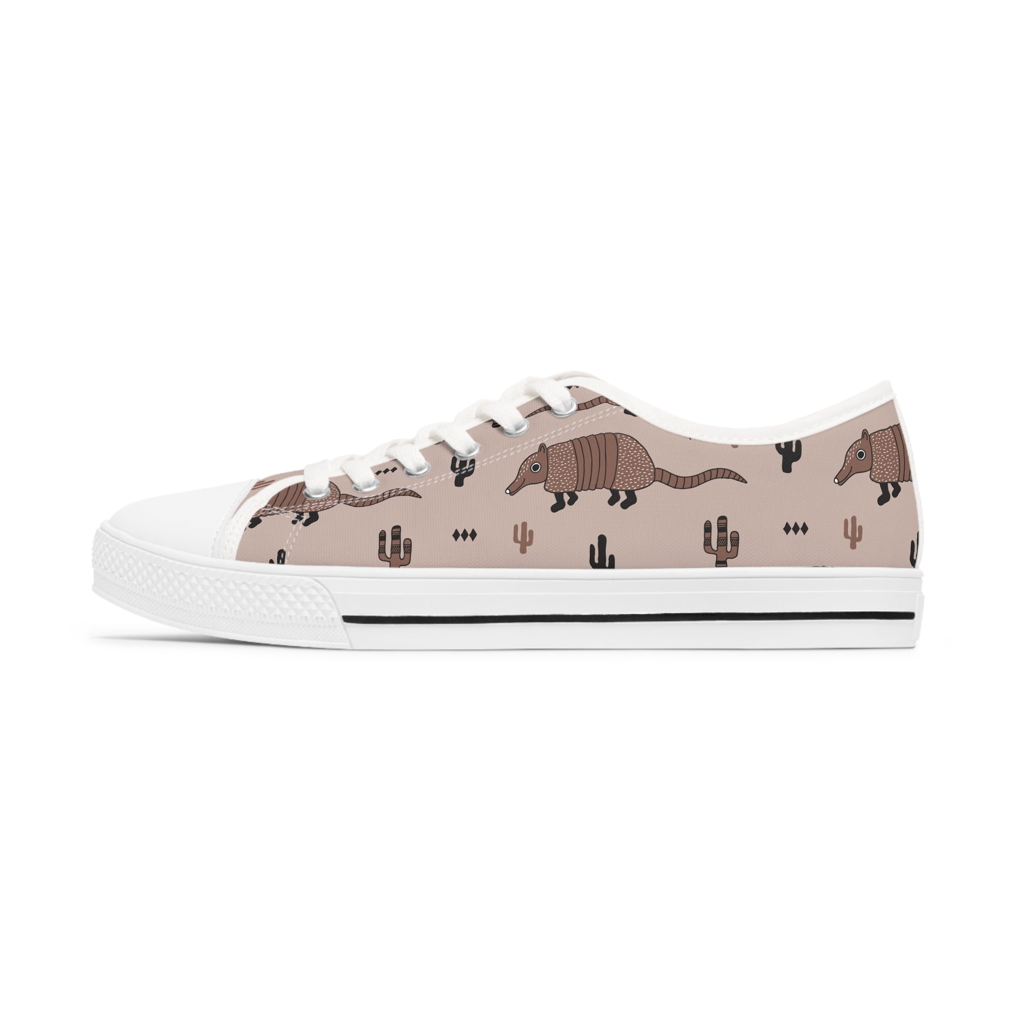 Armadillo Women's Low Top Sneakers in black and white with silver metal eyelets and lace-up closure, showcasing breathable canvas and customizable design.