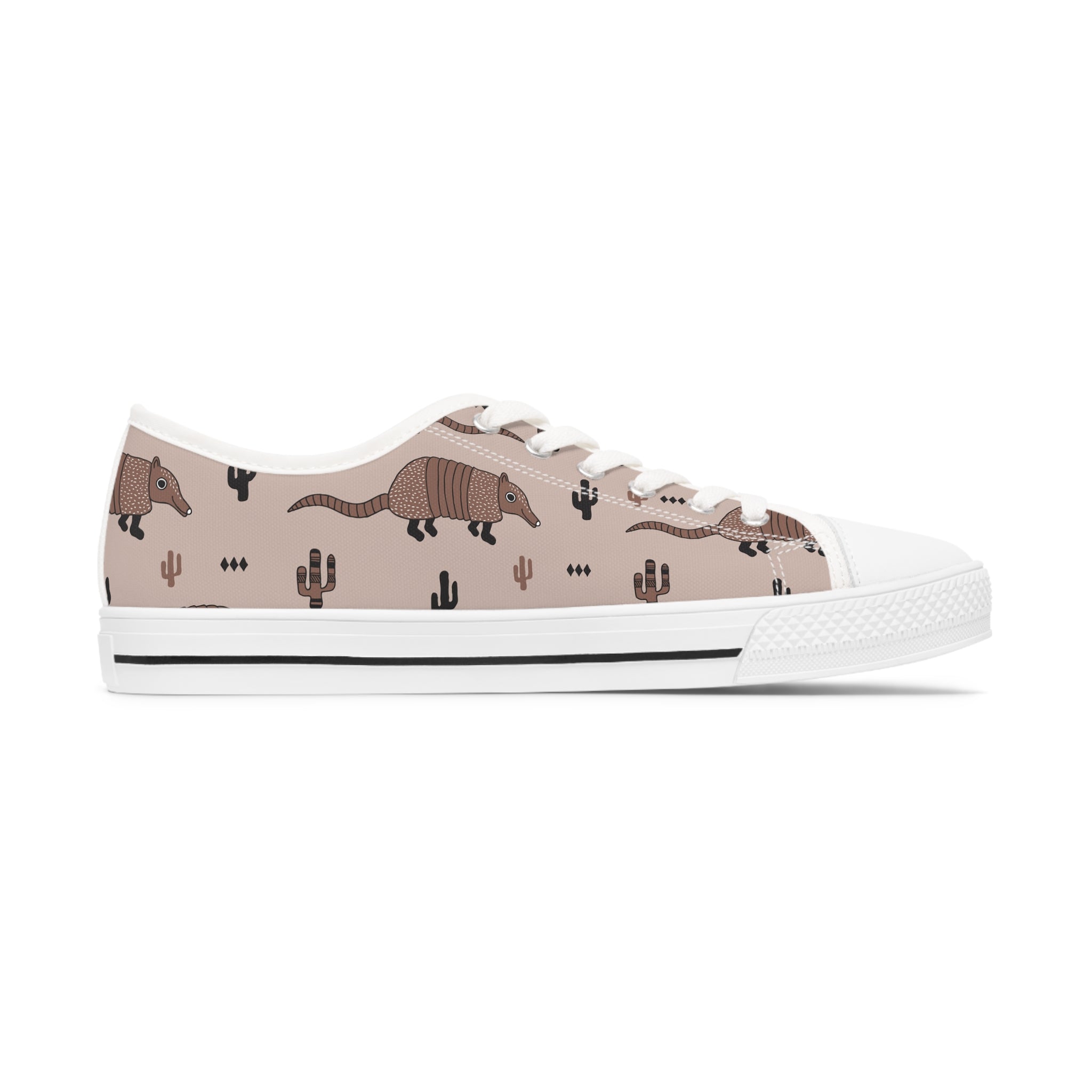 Armadillo Women's Low Top Sneakers in black and white with silver metal eyelets and lace-up closure, showcasing breathable canvas and customizable design.