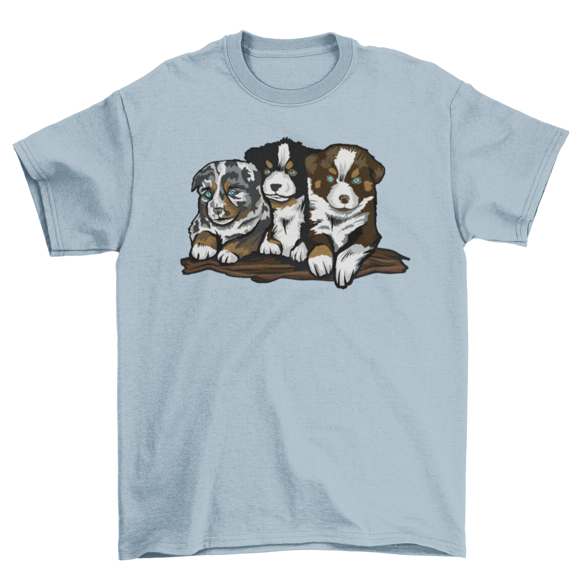 A soft t-shirt featuring three playful Australian Shepherd puppies in a vibrant design.