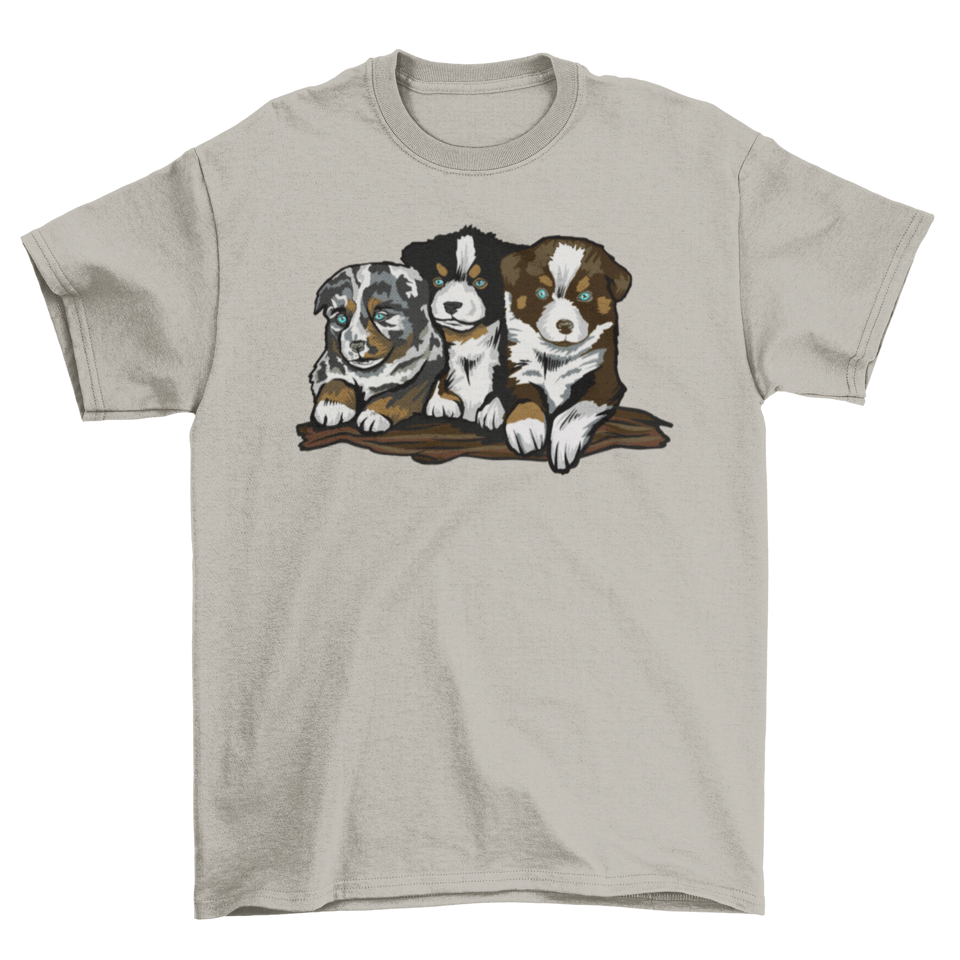 A soft t-shirt featuring three playful Australian Shepherd puppies in a vibrant design.