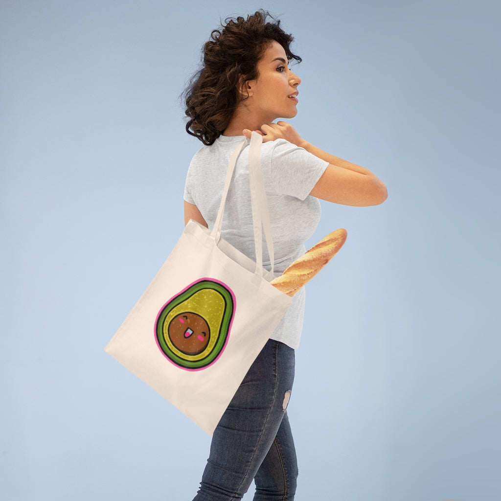 Avocado Tote Bag made of 100% cotton with long handles and cross stitching, available in multiple colors.