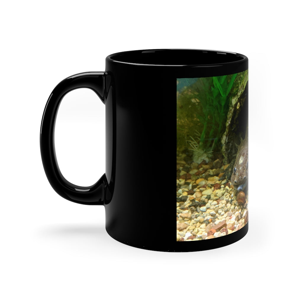 A sleek black ceramic mug with a C-handle, perfect for coffee, tea, or hot chocolate, showcasing its elegant design.