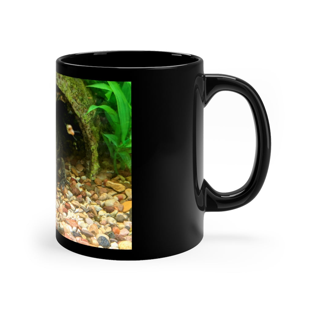 A sleek black ceramic mug with a C-handle, perfect for coffee, tea, or hot chocolate, showcasing its elegant design.