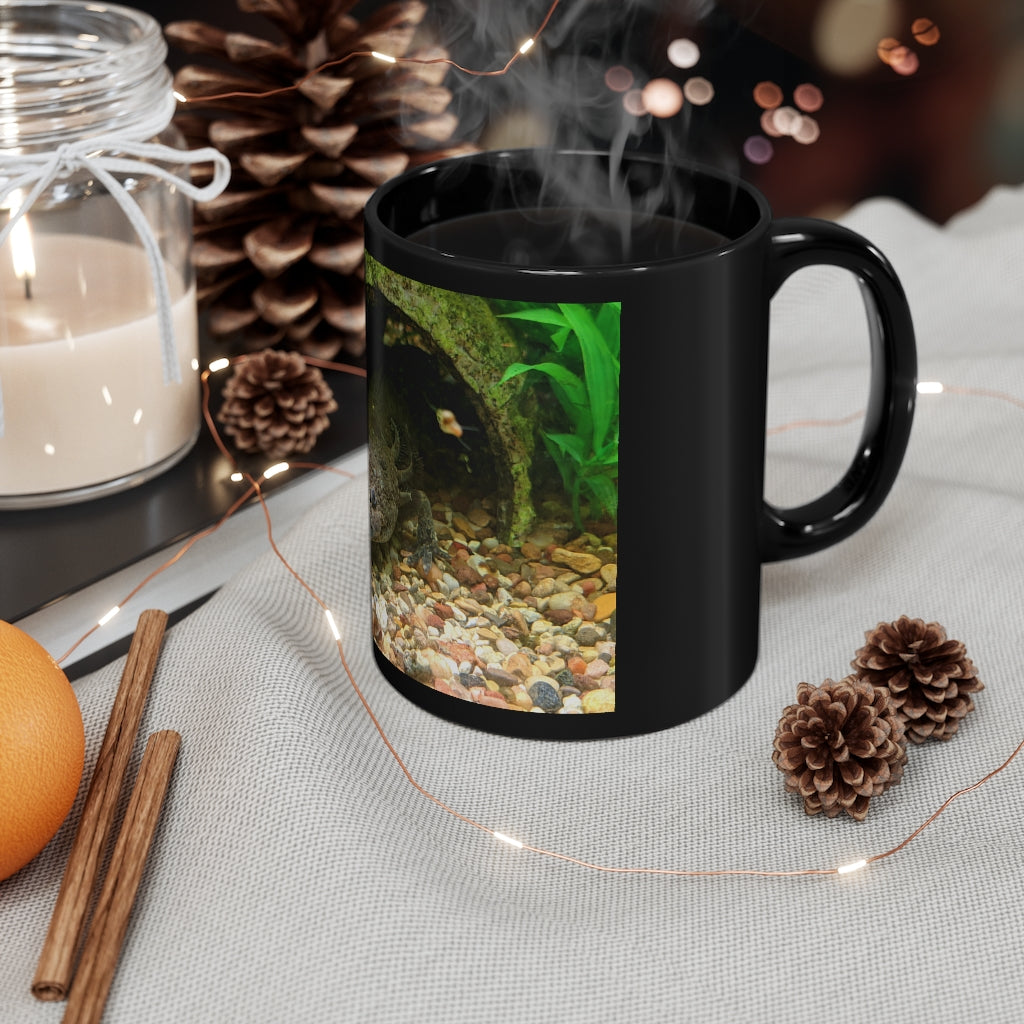 A sleek black ceramic mug with a C-handle, perfect for coffee, tea, or hot chocolate, showcasing its elegant design.