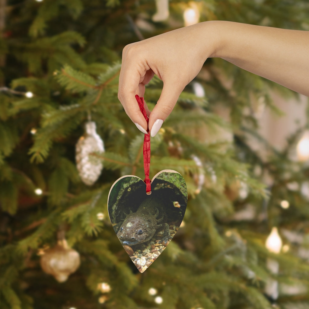 A collection of Axolotl Wooden Christmas Ornaments in various whimsical shapes, featuring a rustic wooden finish and red ribbons for hanging.