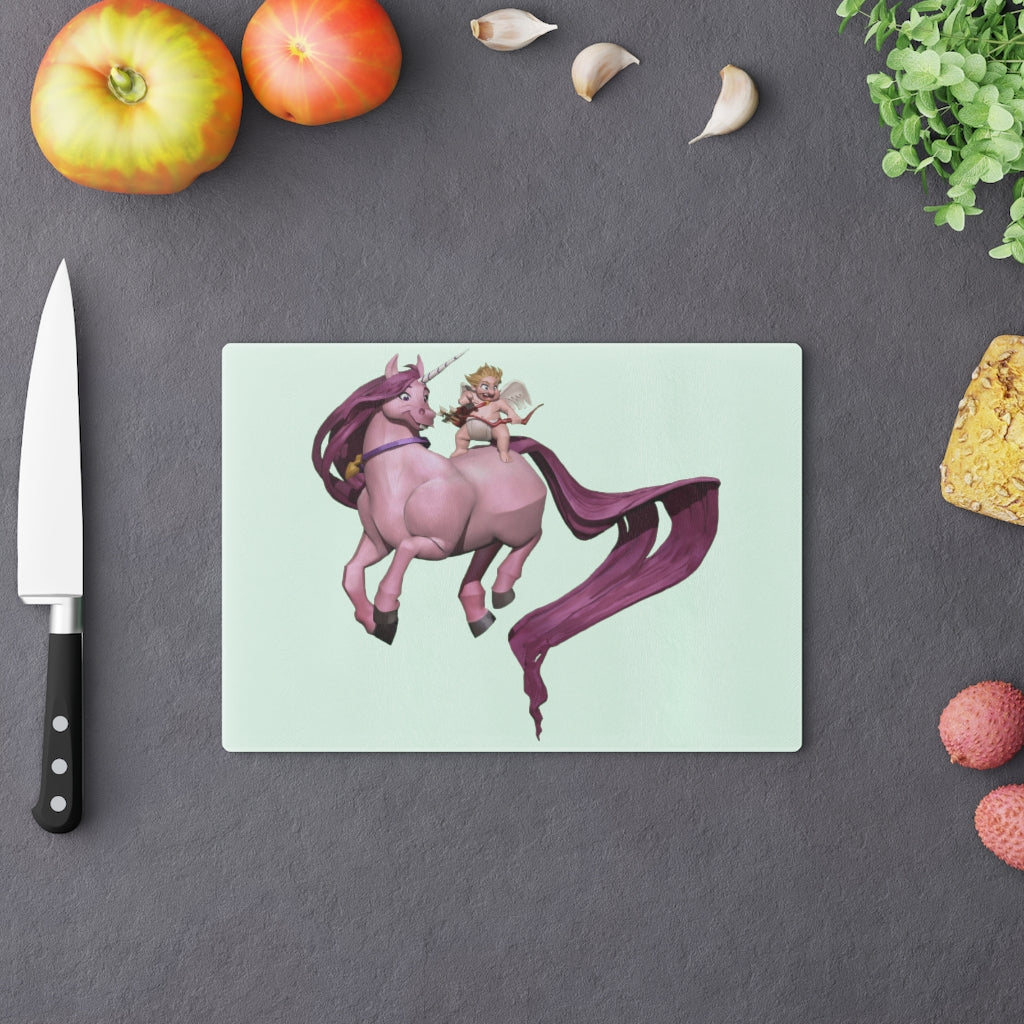 A personalized Baby Cupid and Horse Cutting Board made of tempered glass, featuring a whimsical design and rubber dots for stability.