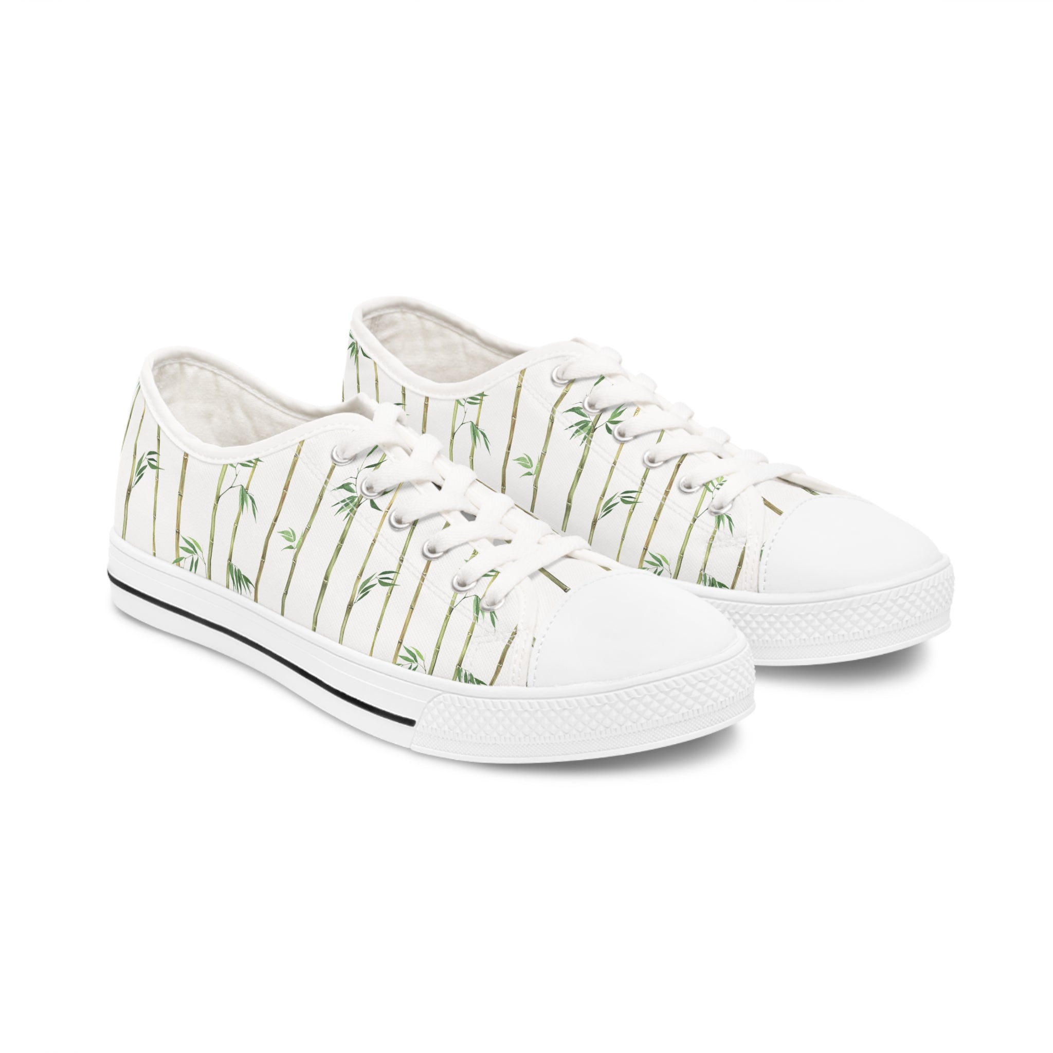 Bamboo Women's Low Top Sneakers in black and white options, showcasing breathable canvas and stylish design with silver metal eyelets.