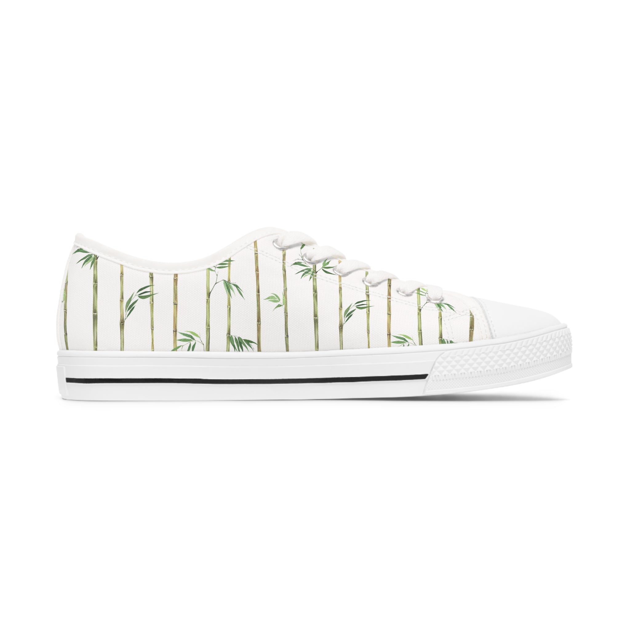 Bamboo Women's Low Top Sneakers in black and white options, showcasing breathable canvas and stylish design with silver metal eyelets.