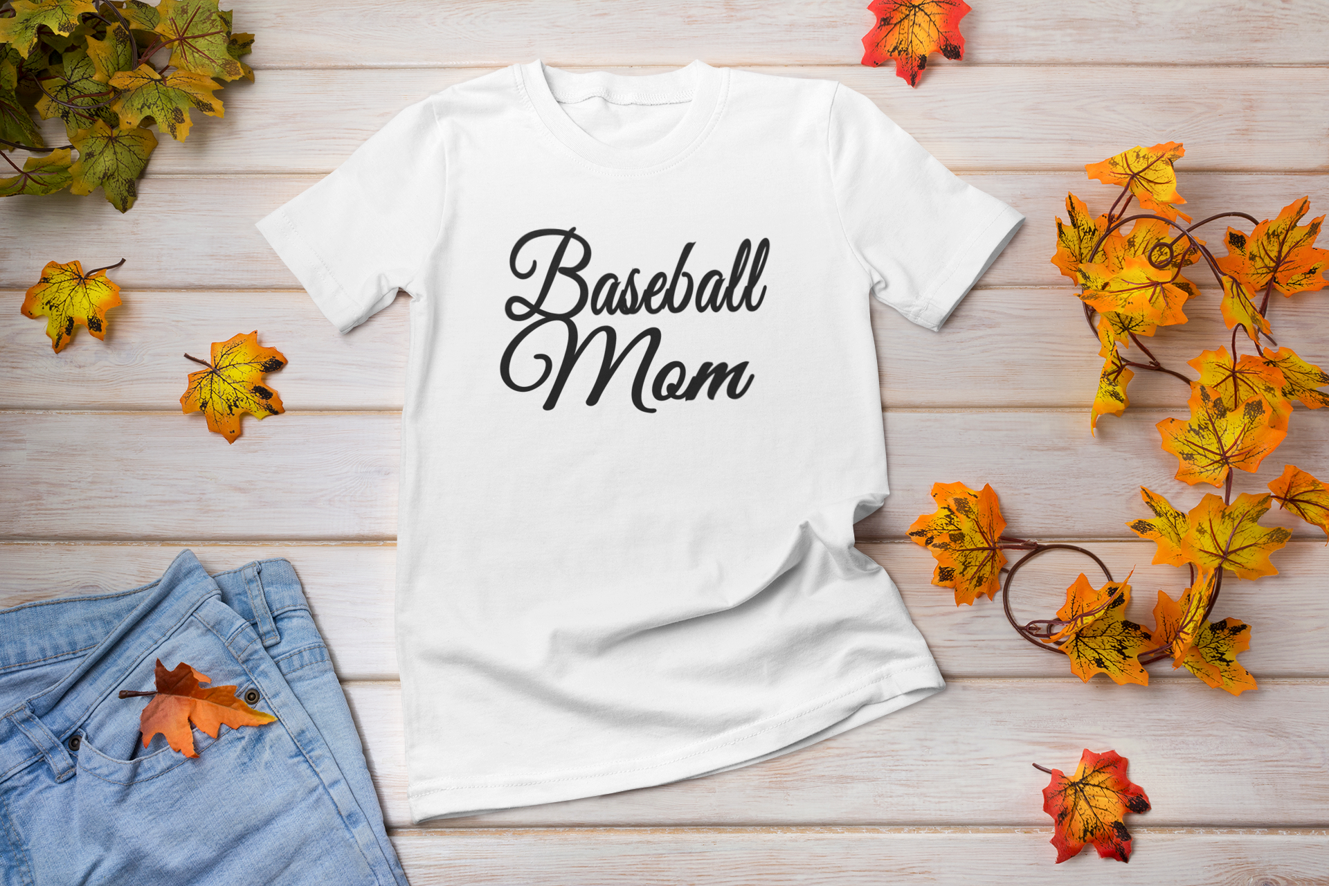 A stylish Baseball Mom Lettering T-shirt featuring bold vinyl print, perfect for proud baseball moms.