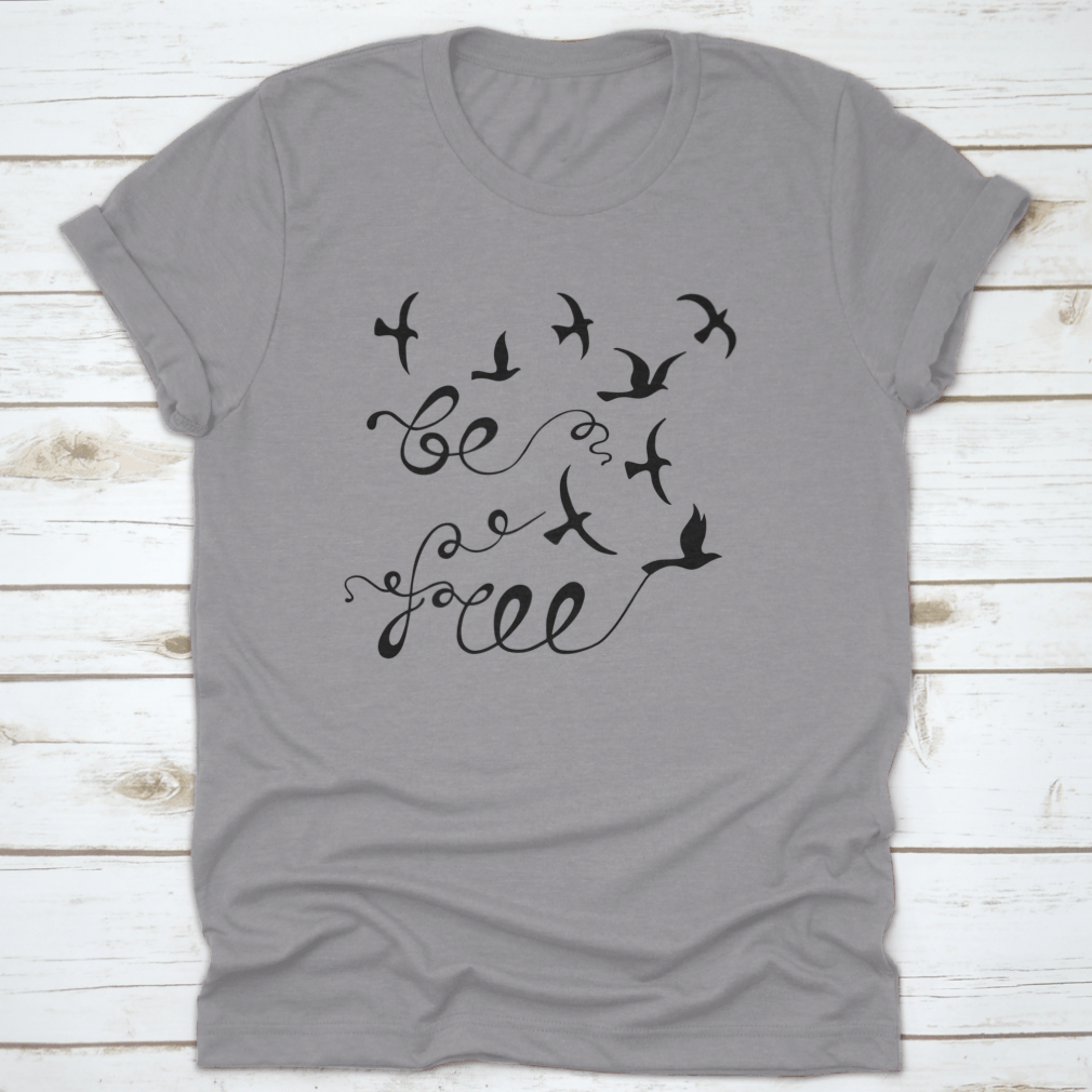 A stylish Be Free Inspirational Quote shirt featuring modern calligraphy on a soft cotton fabric, perfect for casual wear.